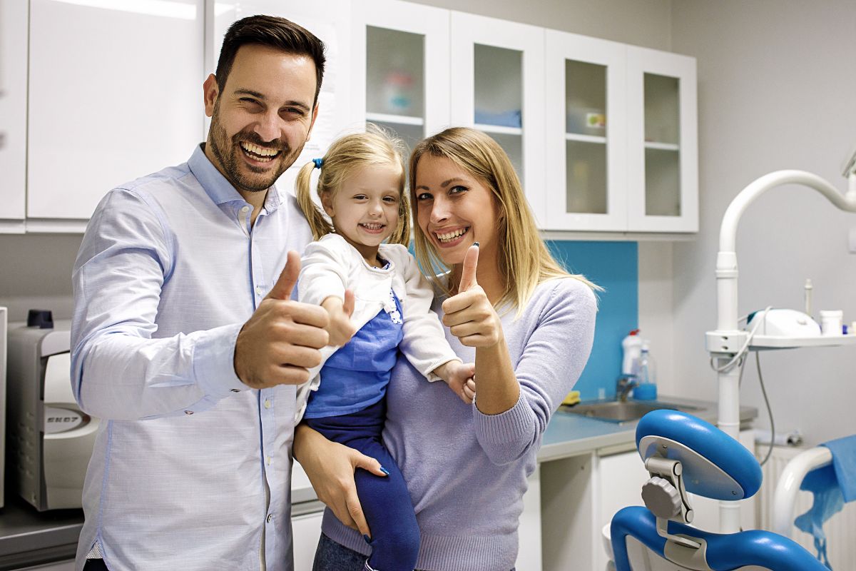 Happy family at kids dental specialist